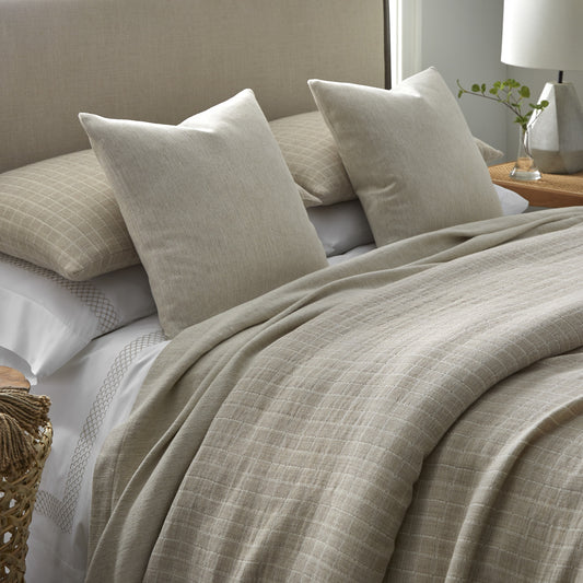 Faro Collection by Home Treasures featuring check-patterned bedding in a wool-cotton blend, with Margaux embroidered sheeting and coordinating Riva bed covers and shams.