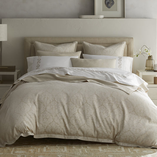 Palma Collection by Home Treasures featuring bedding in a linen and cotton blend with a large-scale motif, paired with Olivia embroidered sheeting and Costa bed covers and shams.