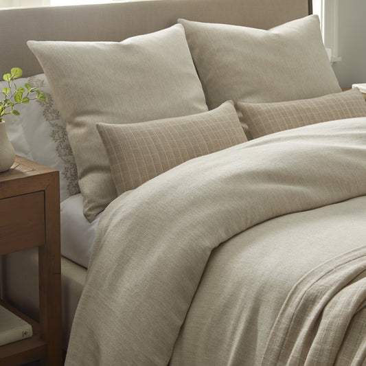 Riva Collection by Home Treasures featuring neutral-toned lightweight bedding, styled with Olivia embroidered sheeting and coordinating Faro bed covers and shams.